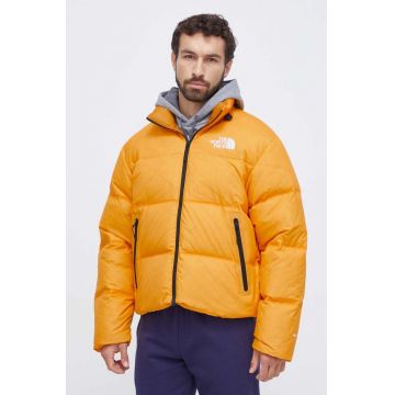 The North Face geaca de puf barbati, culoarea galben, de iarna